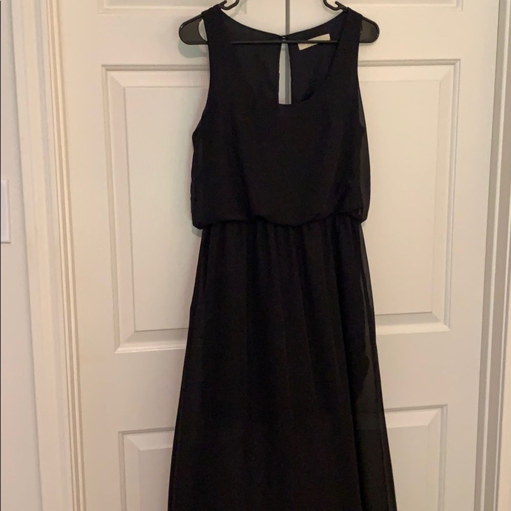 Short black dress with long sheer overlay